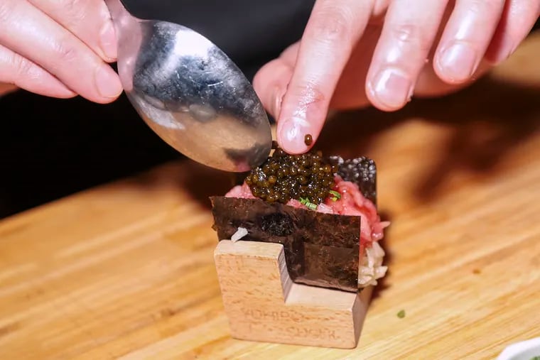 Sean Chen makes the Toro Caviar Truffle U-Maki roll at Yuhiro Omakase Sushi.