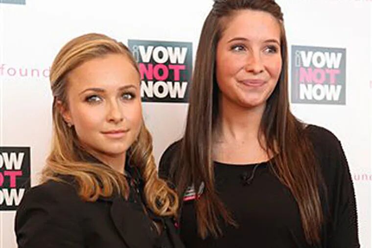 Bristol Palin, daughter of Alaska Gov. Sarah Palin, right and actress Hayden Panettiere pose for photographers on the red carpet during an event to promote National Teen Pregnancy Awareness Day in New York.  (AP Photo/Mary Altaffer)