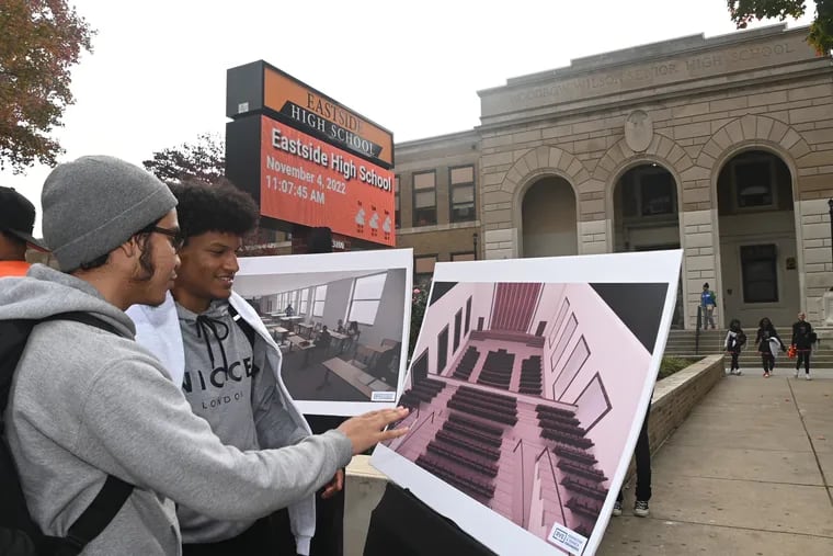 Students stand outside Eastside High School in Camden, one of the 63 districts where school-based youth services will continue after New Jersey backed away from a controversial plan to replace the program with a different model.