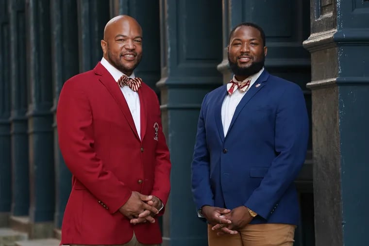 Brothers of Kappa Alpha Psi Will Mega, 46, left, historian Abington-Ambler alumni chapter, and Stanley Griggs II, right, at 8th and Filbert Streets in Philadelphia, July 30, 2019.