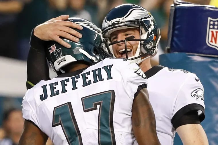 Eagles wide receiver Alshon Jeffery and quarterback Carson Wentz celebrate a second quarter touchdown connection.