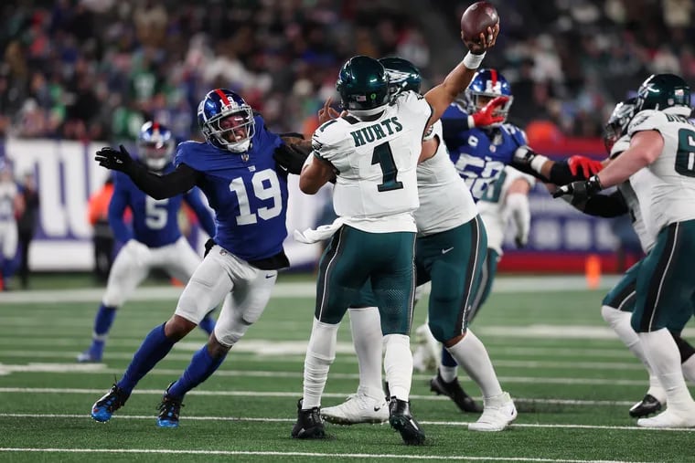 Jalen Hurts #1 of the Philadelphia Eagles passes against Isaiah Simmons #19 of the New York Giants during their game at MetLife Stadium on January 07, 2024 in East Rutherford, New Jersey. (Photo by Al Bello/Getty Images)