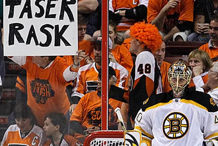 Bruins goaltender put aside Flyers fans' jeers, as well as 34 of the 35 shots he faced. (Matt Slocum/AP)