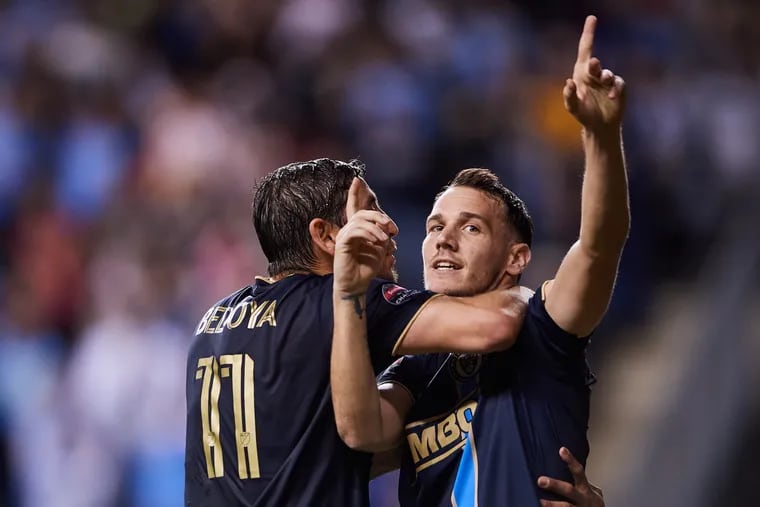Dániel Gazdag (right) celebrates with Alejandro Bedoya (left) after scoring the winning goal for the Union.