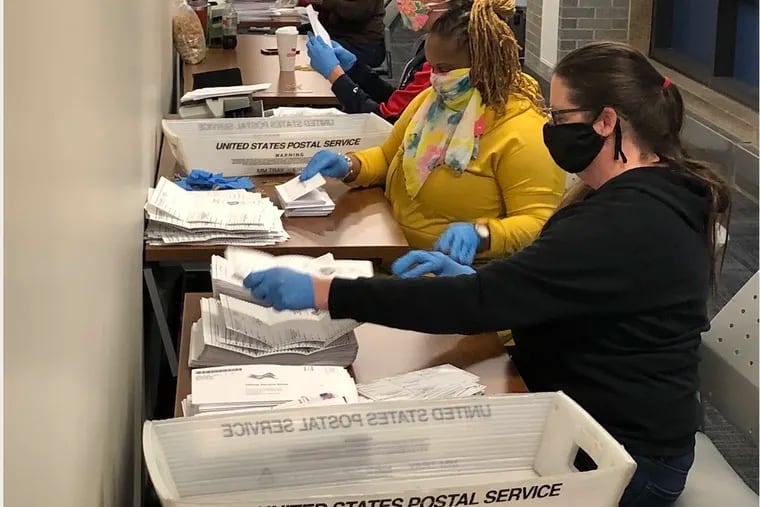 Bucks County elections staff process mail ballots on June 2 primary election day.