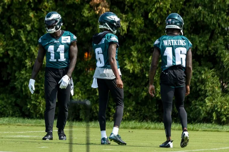 Eagles wide receivers (from left) A.J. Brown, Devonta Smith, and Quez Watkins during practice Friday at the NovaCare Complex.