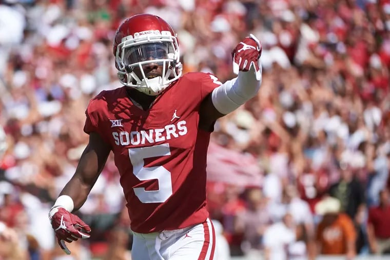 In this Oct. 6, 2018, file photo, Oklahoma wide receiver Marquise Brown (5) gestures "horns down"  as he celebrates after scoring a touchdown on a 77-yard reception against Texas in the second half of an NCAA college football game at the Cotton Bowl in Dallas.