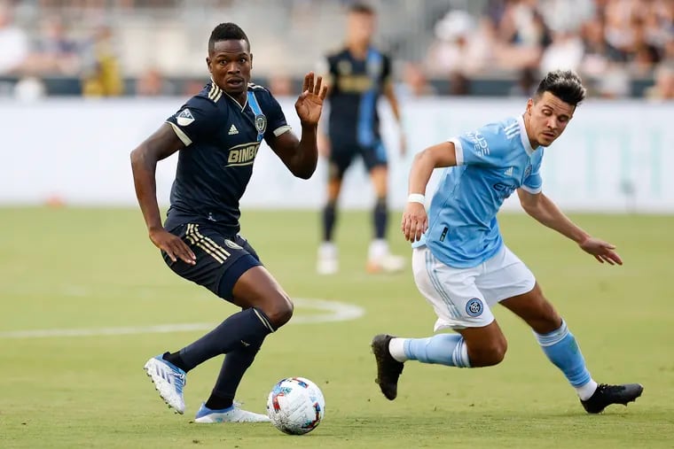 Union forward Cory Burke runs with the soccer ball past New York City FC midfielder Alfredo Morales on Sunday, June 26, 2022 at Subaru Park in Chester, PA.
