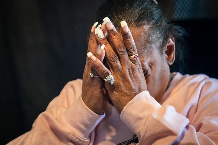 Kathi Camp becomes emotional while talking about the death of her son, Diniar, at her home in Philadelphia, on March 21.