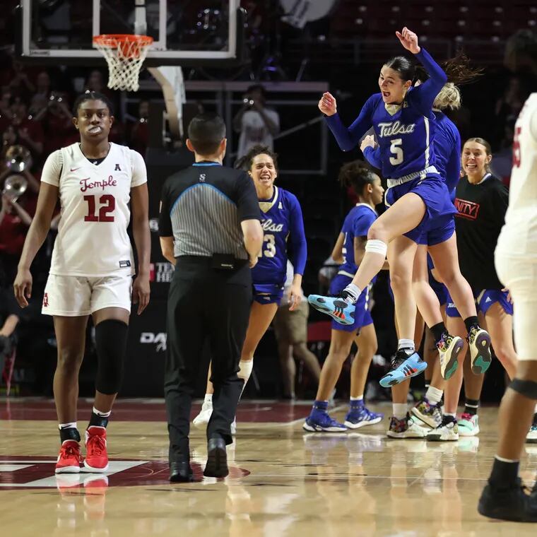 Delanie Crawford, center, and Tulsa teammates celebrate as Temple players walk off the court after their loss to Tulsa at the Liacouras Center on Feb. 28, 2024.