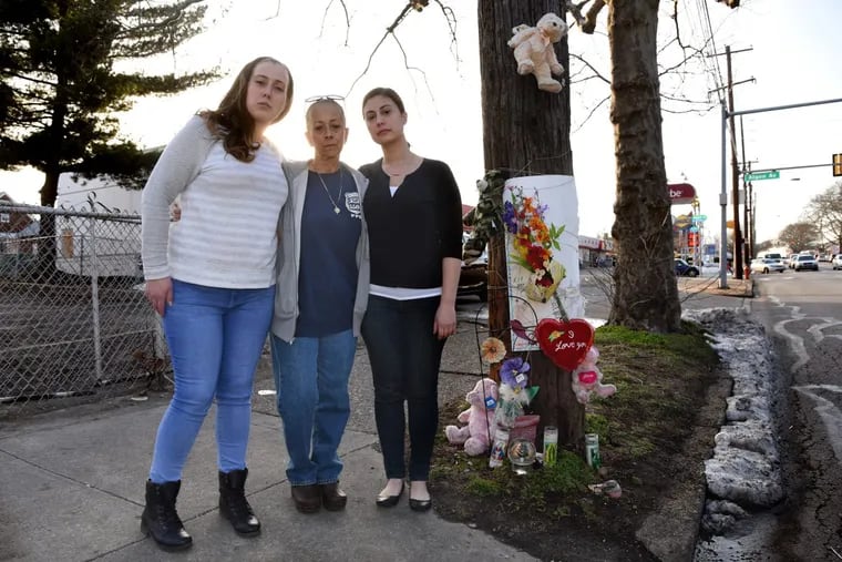 Cheryl Dimitri (center), sister of Danny Dimitri, with her daughters Stephanie (left) and Brittany Prosinski at the Cottman Avenue memorial to Danny Dimitri, who was  killed in January by off-duty Officer Adam Soto.