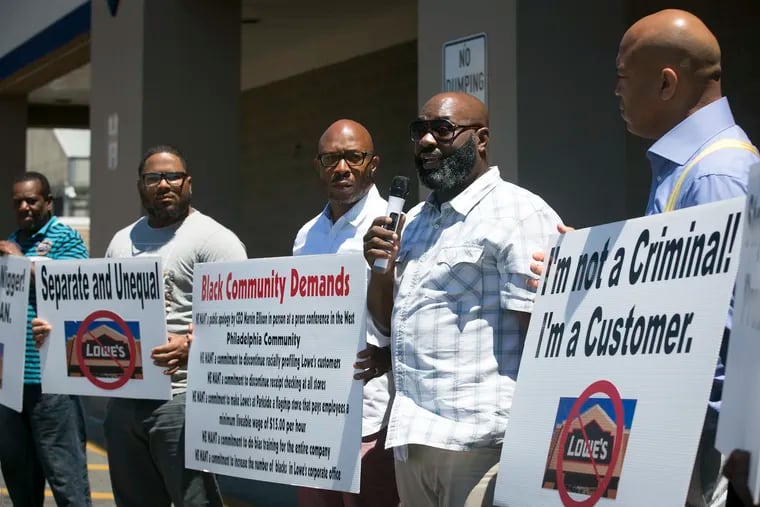 Will Mega (right) and Eric Franks (center right) lead a protest outside of Lowes in West Philadelphia on the afternoon of Saturday, July 7, 2018. They allege that they experienced racial profiling at the store and are calling for a boycott until demands are met.