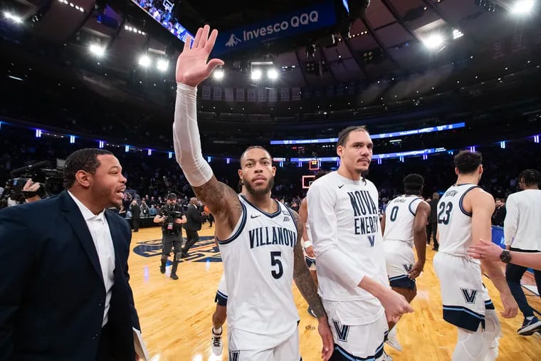 Villanova's Justin Moore waves to the crowd after hitting a three-pointer to defeat DePaul, 58-57, on March 13.