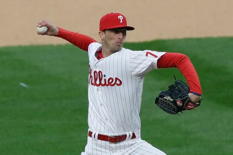 The Phillies' Connor Brogdon delivers a pitch in the 10th inning against the Atlanta Braves in Thursday's season opener.