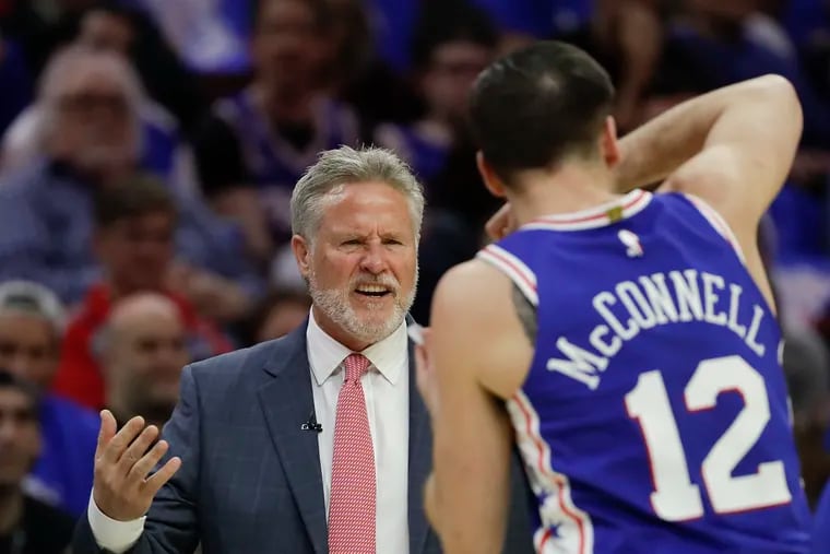 Sixers head coach Brett Brown reacts after a foul call on his team with guard T.J. McConnell during the first-quarter against the Brooklyn Nets in Game 1 of the Eastern Conference playoffs on Saturday.