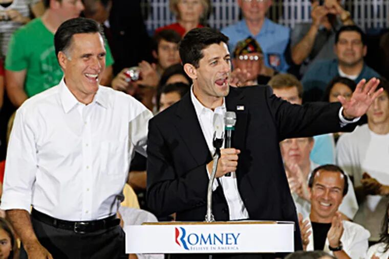 At one of their first events since becoming ticket mates, Mitt Romney (left) and Rep. Paul Ryan campaign in Ashland, Va. STEVE HELBER / Associated Press