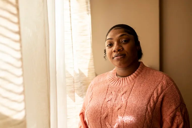 Failsa Hill, 31, of Philly's East Mount Airy section, Home care worker, poses for a portrait in her home on Friday, April 22, 2022. Hill has been working in home care since she was 16. Hill was cheated out of overtime by two different employers, a government investigation found. “They haven’t been paying us all our funds,” Hill said. “They weren’t paying us for overtime. This is my second time going through this and the first time I wasn’t aware of it.”