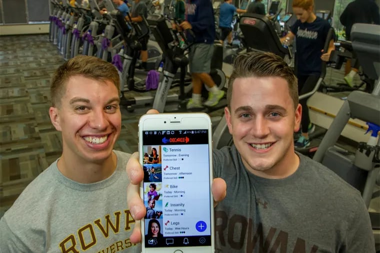 Nick Dennis (left), a senior at Rowan University, and business partner Daniel Read, a graduate of the school, have been given $100,000 to develop their fitDegree app, which allows people to find workout partners. (CLEM MURRAY/Staff Photographer)