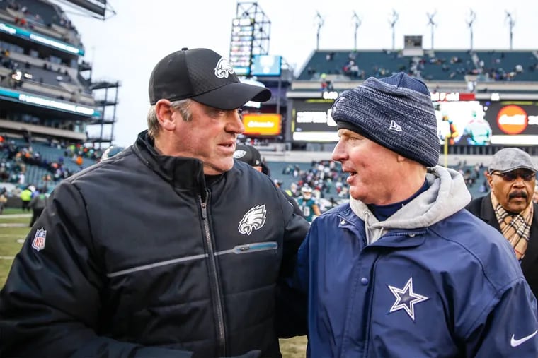 Eagles head coach Doug Pederson (left) talking with Cowboys head coach Jason Garrett.
