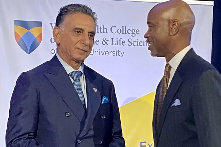 Ali A. Houshmand, president of Rowan University, (left) and Dennis W. Pullin, president and chief executive of Virtua, chat after their presentation of plans for the Virtua Health College of Medicine & Life Sciences.