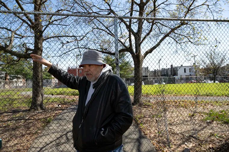 Kensington resident and neighborhood leader Guillermo Garcia points out improvements that have been made around Hope Park. Elected officials, nonprofits, and neighbors have worked to reclaim the park from drug dealers and users over the last two years.