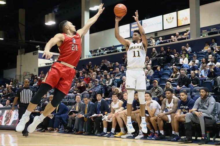 Drexel guard Camren Wynter scored 18 points in the win. In this file photo, Wynter shoots past Northeastern guard Guilien Smith during a game at the Daskalakis Athletic Center in Philadelphia on Saturday, Feb. 22, 2020.
