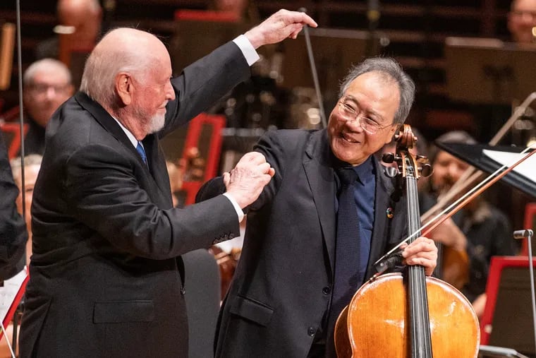 Composer John Williams (left) directs the applause to Yo-Yo Ma after the cellist performed Williams' "Cello Concerto" with the Philadelphia Orchestra in Verizon Hall on Feb. 20, 2024.