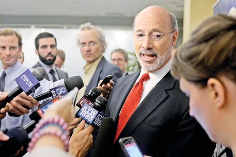 Tom Wolf   talks with news media outside the studio after his debate with Republican Governor Tom Corbett  October 1, 2014 on KYW Newsradio's "Breakfast with the Candidates." ( TOM GRALISH / Staff Photographer )
