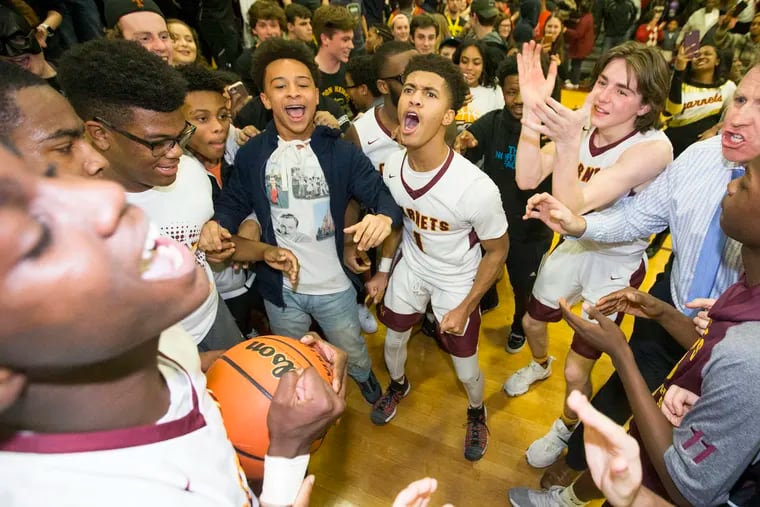 Haddon Heights celebrates their 80-78, overtime victory over Pleasantville in the  first round of South Jersey 2 tournament in boys' basketball on Feb. 27, 2018.