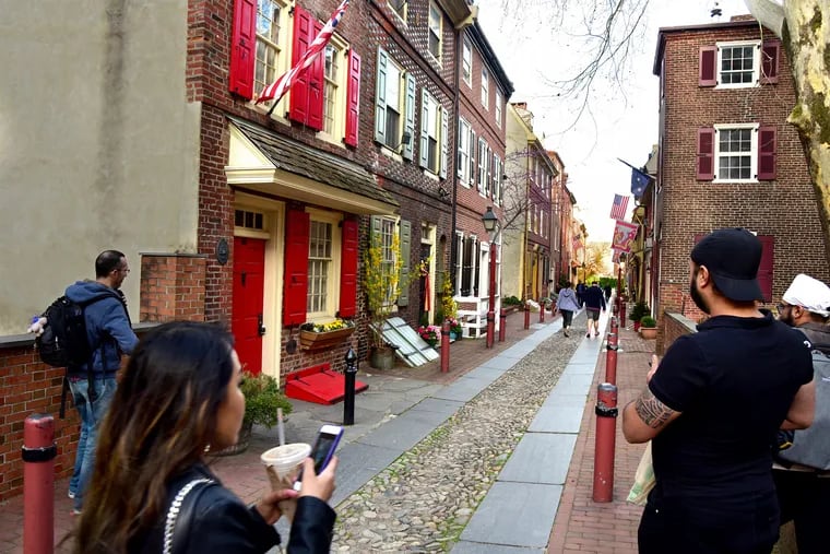 139 Elfreth's Alley (left) is listed for sale for $1.2 million. The home, with red shutters and a red door, is being marketed as the oldest home on the nation's oldest continually occupied block.