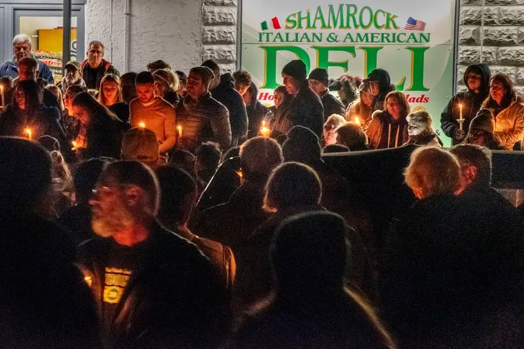 Family, friends and neighbors gather for a vigil outside the Shamrock Deli in Audubon Jan. 6, 2020 for owner Jerome Pastore, 57, who was fatally stabbed Friday, allegedly by a teenager who stole the deli's tip jar.