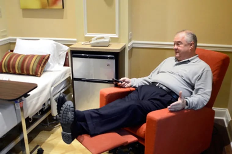 At the Genesis PowerBack rehab facility in Voorhees, William G. Burris Jr. demonstrates a recliner. (Tom Gralish / Staff Photographer)