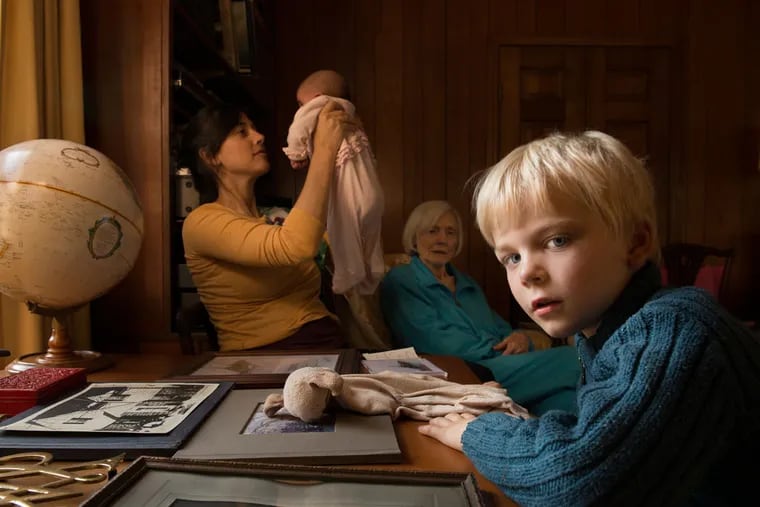 &quot;Marshall with Family and the World&quot; by Jessica Todd Harper, is in a show of her photographs at the Print Center through March 28. Harper's large portraits give a nod to Vermeer, Cassatt, Sargent, and Whistler.