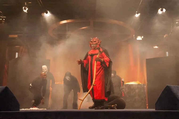 Saul Singleton, of Voorhees, plays the devil in "A Trip to Hell" at Living Faith Christian Center in Pennsauken, N.J. on Thursday, Oct. 29, 2015.