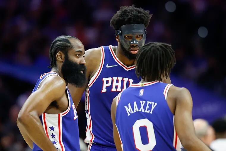 Sixers center Joel Embiid with guards James Harden (left) and Tyrese Maxey during the second-round Eastern Conference playoff series against the Miami Heat in May.