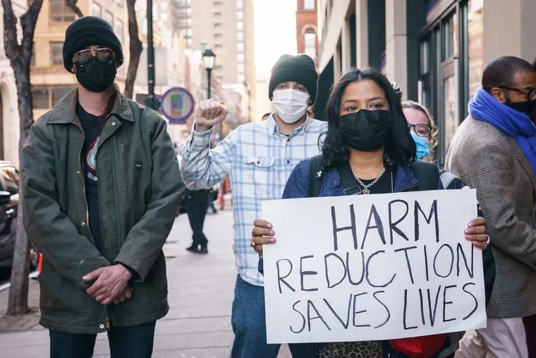 Rosalind Pichardo (front), with Operation Save Our City, stands with other harm reduction supporters in Philadelphia on March 2, 2022.