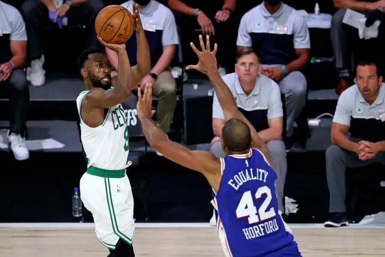 Boston Celtics guard Kemba Walker (8) shoots over Philadelphia 76ers forward Al Horford (42) during the second half in a NBA basketball first round playoff game at The Field House.