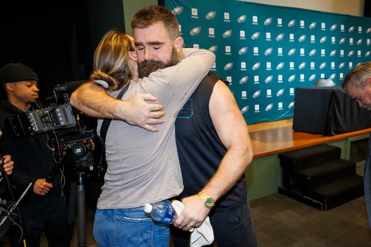 Jason Kelce embraces his wife, Kylie after delivering an emotional retirement speech at the Novacare Complex in Philadelphia on Monday.