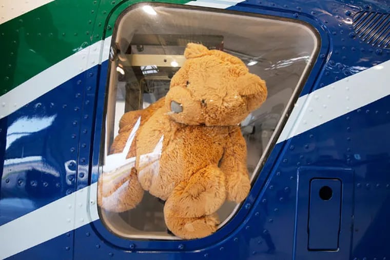 Cook Children's "Teddy Bear" Transport, which was created especially for child patients, flew to Brownwood, Texas, to pick up a newborn baby boy with a heart defect on Tuesday, July 8, 2014. The stuffed bear sits in the window of their helicopter. (David Woo/Dallas Morning News/MCT)