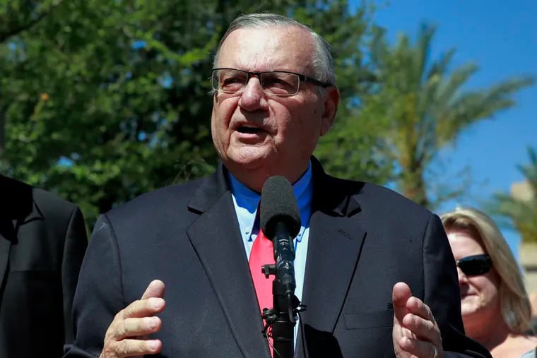 FILE _ In this May 22, 2018, file photo, former Maricopa County Sheriff Joe Arpaio speaks during a campaign event in Phoenix. Arpaio filed a defamation lawsuit against three news organizations on Monday, Dec. 10, alleging that their inaccurate references to his criminal case have hurt his chances in possibly running in 2020 for the Senate. (AP Photo/Matt York, File)