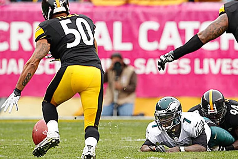 Michael Vick lost two fumbles in the Eagles' 16-14 loss to the Steelers. (Ron Cortes/Staff Photographer)