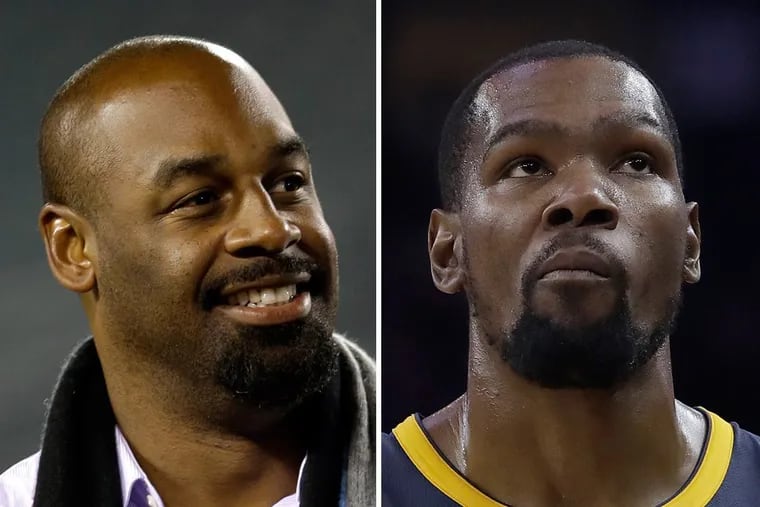 Former Eagles quarterback Donovan McNabb (left) was brushed back on Twitter by Brooklyn Nets superstar Kevin Durant over comments about teammate Kyrie Irving.