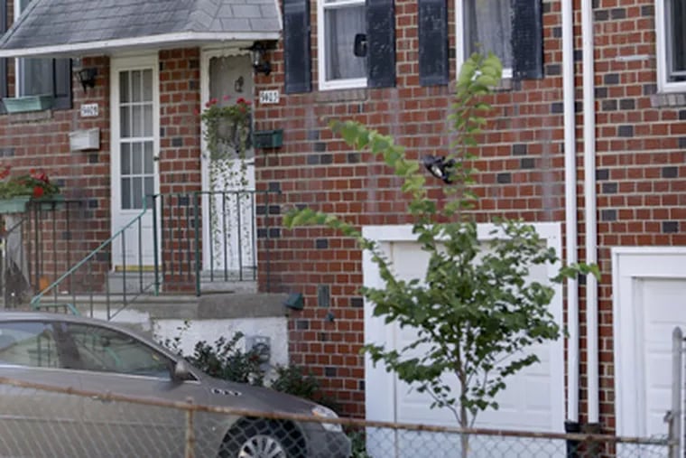 In this Wednesday, Sept. 19, 2012 photo, the home of Johann "Hans" Breyer, center, is seen in Philadelphia. (AP Photo/Matt Rourke)