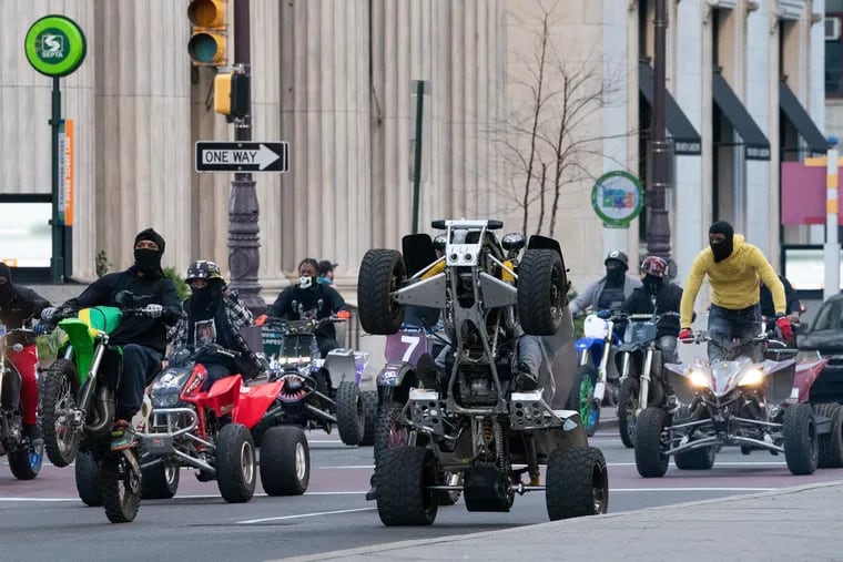 Dirt bike and ATV riders on South Broad Street near City Hall in Philadelphia in April.