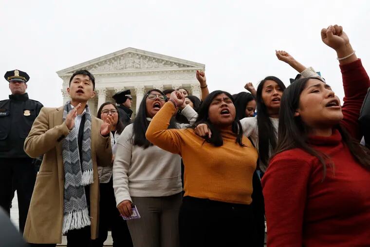 DACA recipients and others leave the Supreme Court with their hands in the air after oral arguments were heard in the case of President Trump's decision to end the Obama-era, Deferred Action for Childhood Arrivals program.