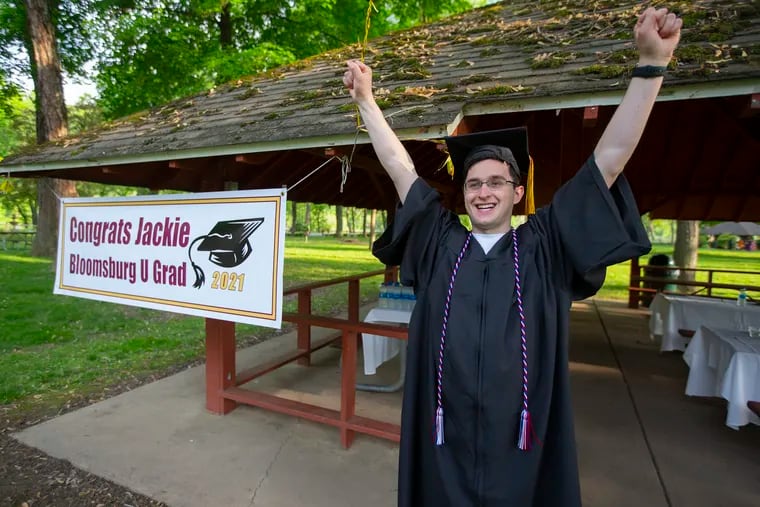 Jackie Lithgow’s recovery is a miracle. During his freshman year at Bloomsburg University, he suffered severe head trauma which nearly claimed his life while trying to break up a fight.  Against many odds, he graduated from college on Sunday May 16, 2021 at Bloomsburg University.  His raises his arms at a post-graduation picnic celebration.
