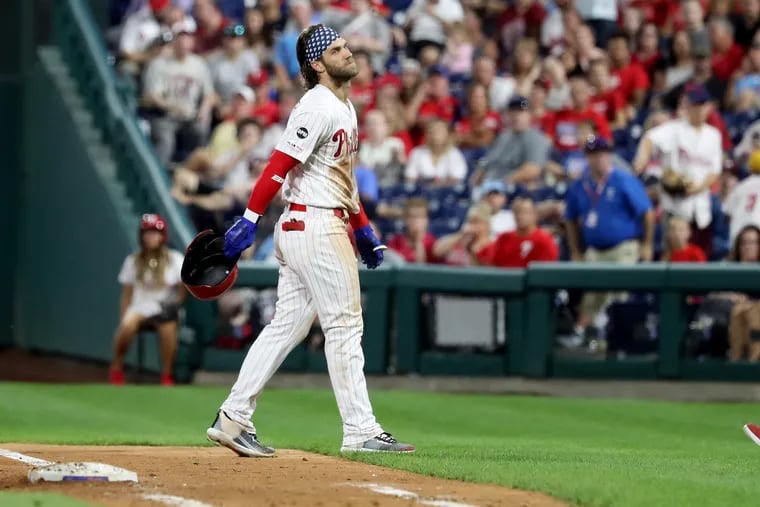 Phillies right fielder Bryce Harper expresses disappointment Wednesday night after hitting into a double play with the bases loaded in the fifth inning against Braves lefty Dallas Keuchel.