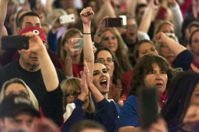 Teachers and school personnel celebrate after the state Senate approved a bill to increase state employee pay by 5 percent at the capitol in Charleston, W.Va., last Tuesday.