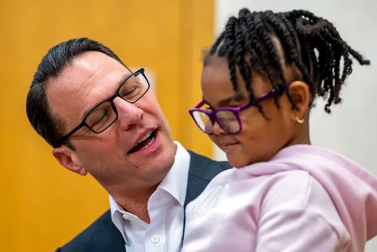 Gov. Josh Shapiro talks with a child care youngster as he hosts a press conference the YWCA in York, Pa. Tuesday, Jan. 9, 2024, part of his “GSD Tour” (get “stuff” done) highlighting the Expanded Child and Dependent Care Tax Credit, as he finishes his first year in office.