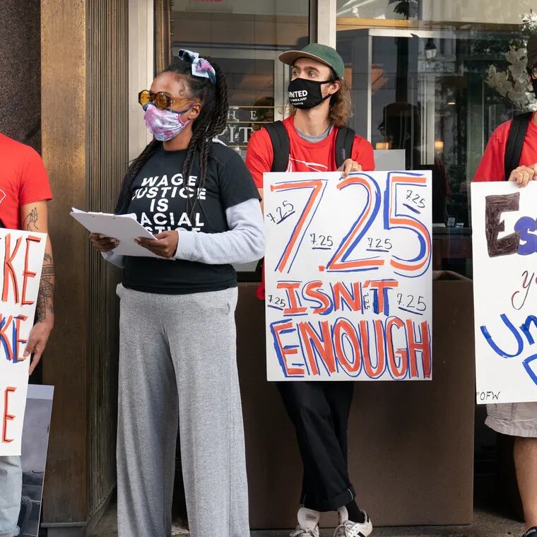 Restaurant workers in Philadelphia demonstrate at Broad and Chestnut Streets demanding a $15 minimum wage for all workers, in this 2020 photo.